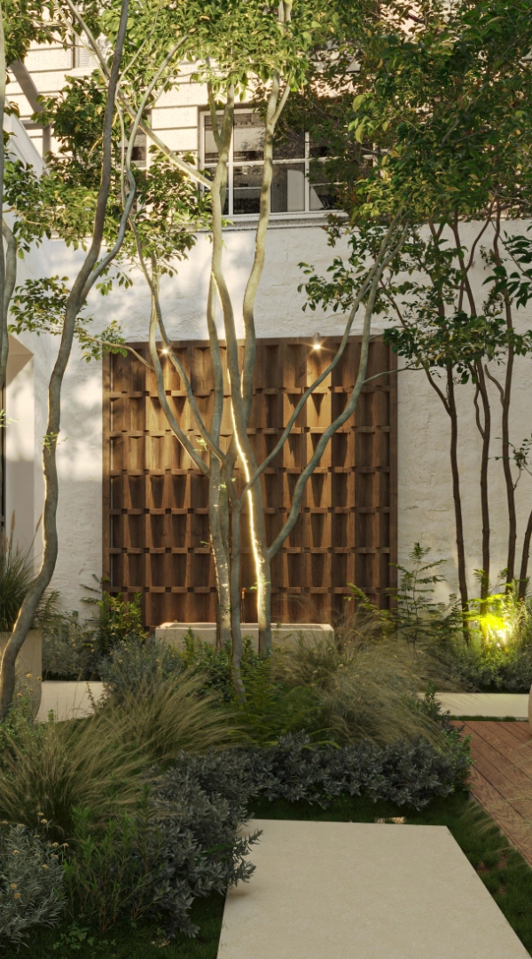 Ein schattiger Wiener Innenhof mit einer Baumgruppe vor einer Fensterfront